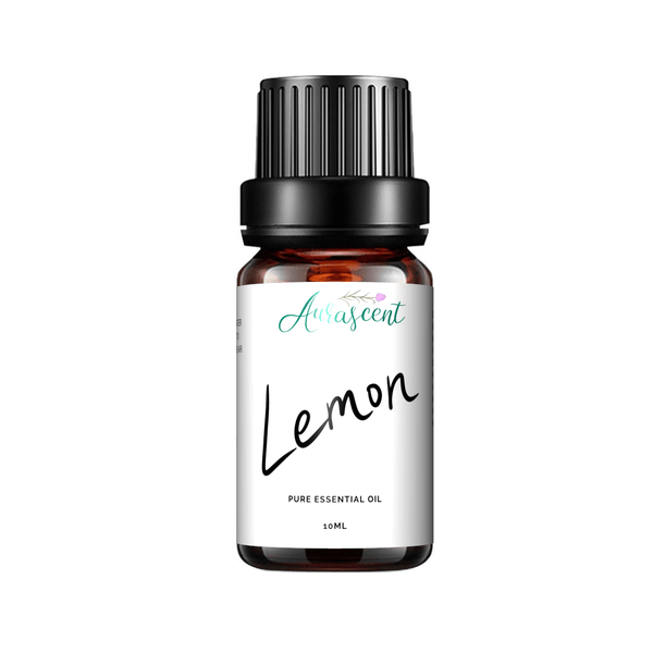 Aurascent Lemon Essential Oil bottle, 10 ml, with fresh lemon slices and sprigs of herbs on a white background.