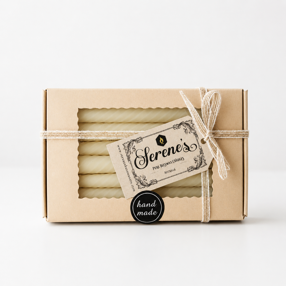Serenes Beeswaxory pure beeswax twirl taper candle with a twisted design, standing upright on a white background.
