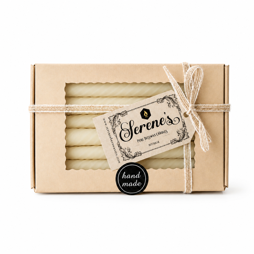 Eight pure beeswax Twirl Taper candles in a box, natural honey color, from Serenes Beeswaxory, suitable for decorative or ceremonial use.
